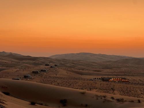 a view of the desert at sunset at Liwa Nights ليالي ليوا in Liwa