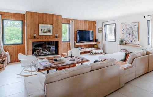 a living room with a couch and a fireplace at Maison Avec Piscine in La Roque-Esclapon