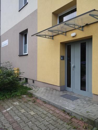 a front door of a building with a glass door at MIKO apartament in Mikołów