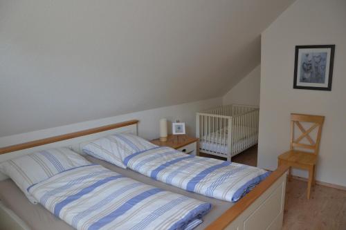 Ένα ή περισσότερα κρεβάτια σε δωμάτιο στο Perlmuschel