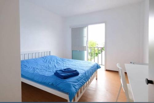 Postel nebo postele na pokoji v ubytování วีพี รีสอร์ท ราชบุรี - VP Resort Ratchaburi