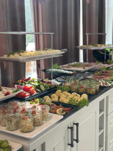 a buffet line with many different types of food at Fregata Kołobrzeg in Kołobrzeg