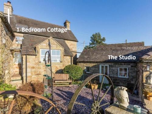 a building with a sign that reads the studio at Hill End Cottages in Warslow