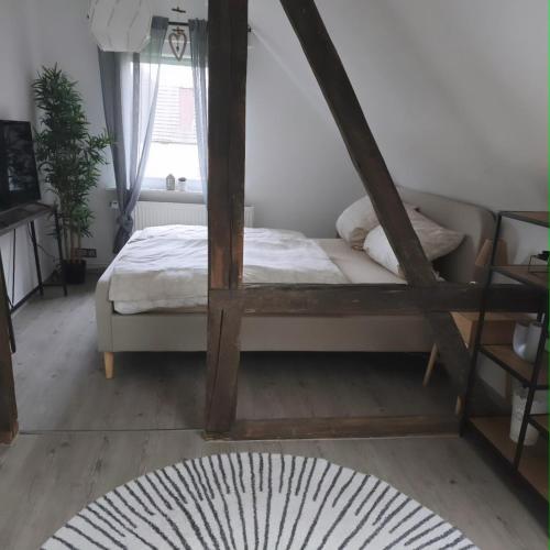 a bedroom with a bed and a window at Haus Kerkyra in Dickesbach
