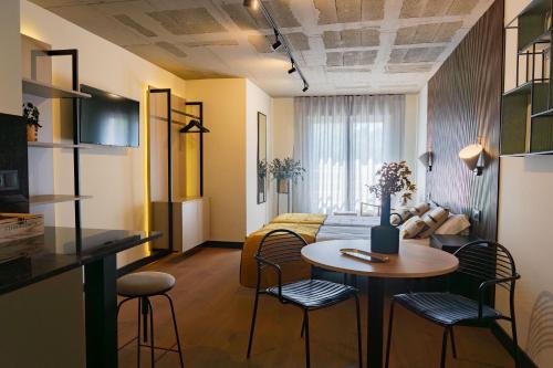 a room with a bed and a table and chairs at BUBU Apartments By Exclusive Homes in Málaga