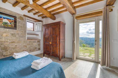 Ένα ή περισσότερα κρεβάτια σε δωμάτιο στο Agriturismo Le Sorgenti