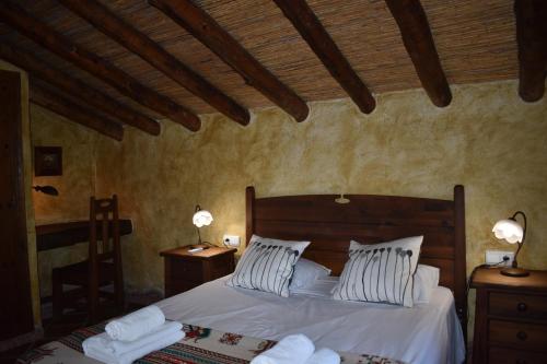 Ένα ή περισσότερα κρεβάτια σε δωμάτιο στο Finca Algarabia with private Pool