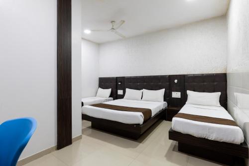 Postel nebo postele na pokoji v ubytování Hotel Ajwa