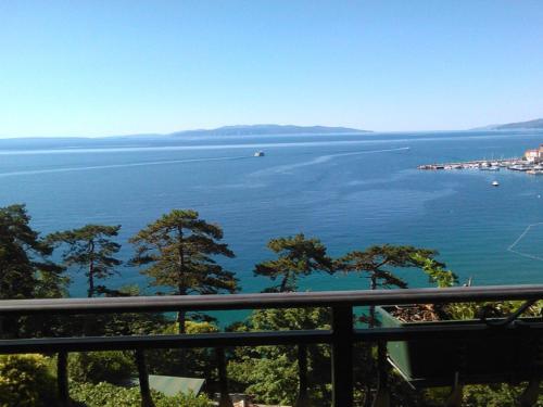 a view of a large body of water with trees at VILLA VOLOSKO with private parking and breakfast,seaview in Volosko