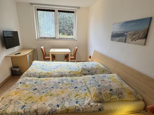 Postel nebo postele na pokoji v ubytování Pension Hirschburg Ferienwohnung 11 - Bad Sülze