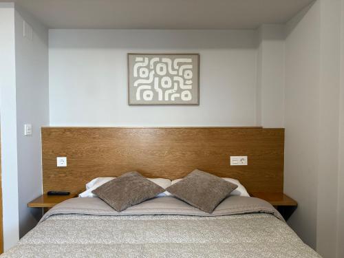 Postel nebo postele na pokoji v ubytování Hostal Restaurante Iruñako