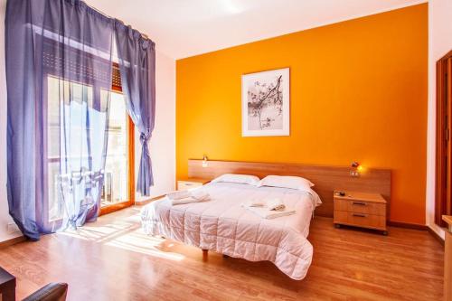 Ένα ή περισσότερα κρεβάτια σε δωμάτιο στο Central Plaza Lecce