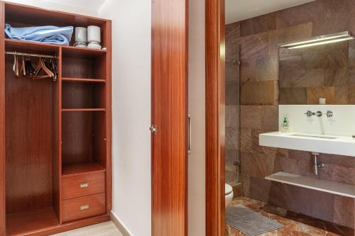a bathroom with a shower and a toilet and a sink at Villa con Infinity pool in Lloret de Mar