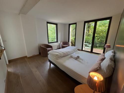 Postel nebo postele na pokoji v ubytování Les Vignes Rouges