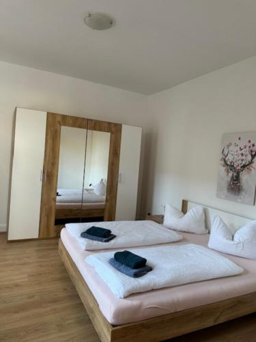 Postel nebo postele na pokoji v ubytování Ferienwohnungen Am Westerntor Amber Pepe und Paula inkl Parkplatz