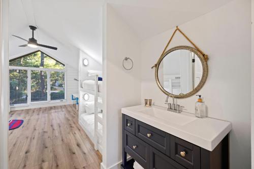 a bathroom with a sink and a mirror at SI2995: 2995 Seabrook Island Rd. in Seabrook Island
