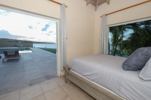 Postel nebo postele na pokoji v ubytování Turtle Cove House by Le Haus