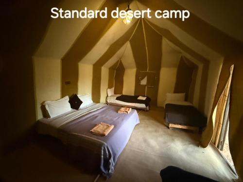 Ένα ή περισσότερα κρεβάτια σε δωμάτιο στο Standard Desert Camp