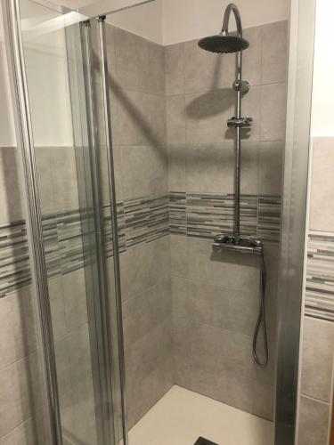 a shower with a glass door in a bathroom at Roma Sister in Rome