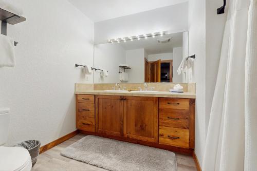 a bathroom with a sink and a mirror at Main Street Station #1210 in Breckenridge