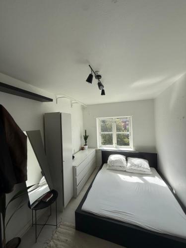 Ένα ή περισσότερα κρεβάτια σε δωμάτιο στο Superb apartment in central Copenhagen