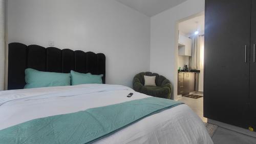 Ένα ή περισσότερα κρεβάτια σε δωμάτιο στο Studio Apartment - The Arc II