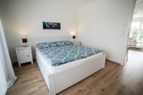 En eller flere senge i et værelse på Ferienwohnung Gaisweiher, Dinkelsbühl