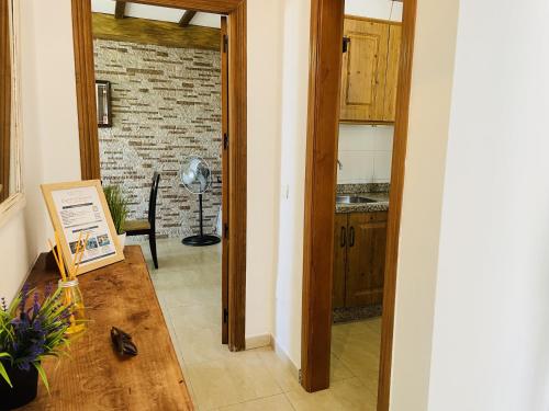 a kitchen with a door open to a living room at Casa Blanca con vistas by At Home Costa del in Torrox Costa