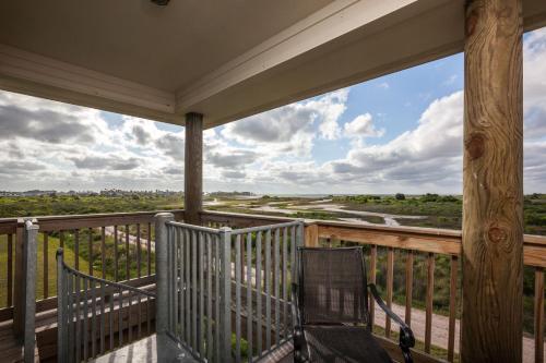 a view from the balcony of a house at Sandy Hook in Galveston