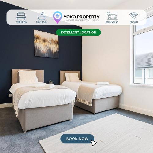 two beds in a room with a sign that reads javascript location at Herschell House - Central Location - Free Parking, Fast Wifi, SmartTV with Netflix - Perfect for Contractors, Families and Groups by Yoko Property in Redcar