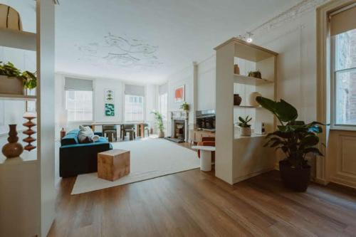 a living room with a couch and a table at The Catnap Suite in Shrewsbury