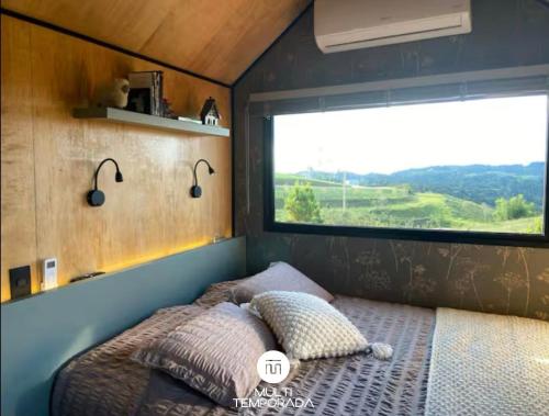 Ένα ή περισσότερα κρεβάτια σε δωμάτιο στο Via Kairós - Rancho Queimado/SC