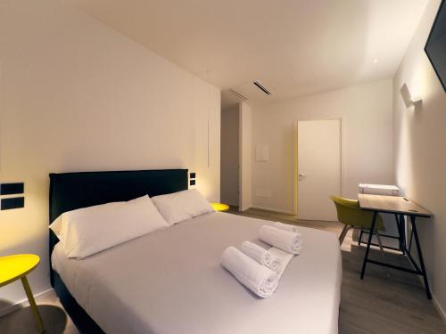 Ένα ή περισσότερα κρεβάτια σε δωμάτιο στο Dimora in Prato