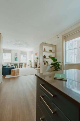 a large living room with a table and a couch at The Catnap Suite in Shrewsbury