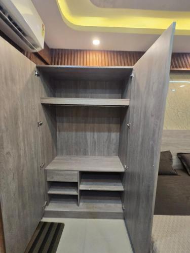a walk in closet in a room at Cozy Studio in Ghaziabad