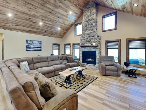 a living room with a couch and a fireplace at Mountain Whisper in McHenry