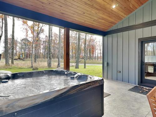 a large jacuzzi tub in a screened in patio at Mountain Whisper in McHenry