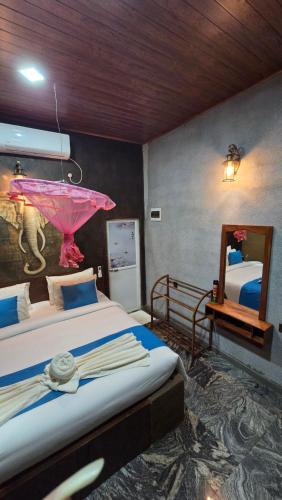 Postel nebo postele na pokoji v ubytování Ceylon wilpattu safaris & lodging