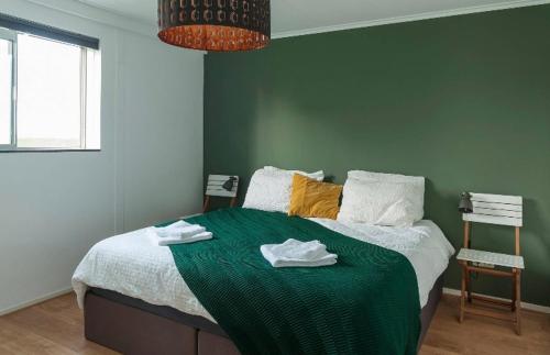 En eller flere senge i et værelse på Apartment de Broekkant