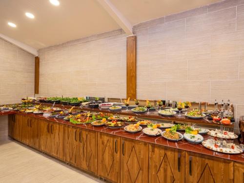 a buffet line with many different types of food at Cappadocia ByHan Hotel - Special Class in Uchisar