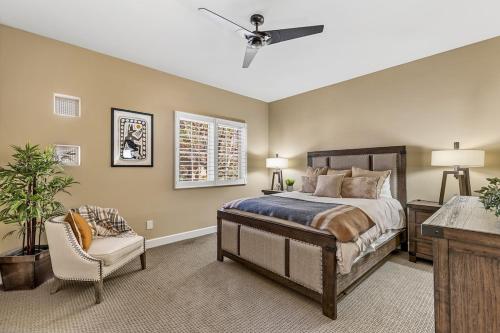 a bedroom with a bed and a chair at Minutes 2 NAU & downtown & Snowbowl! in Flagstaff