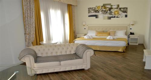 a hotel room with a bed and a couch at Best Western Hotel Colaiaco in Anagni