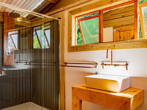 a bathroom with a sink and a shower at AfriCamps at Mackers in Hazyview