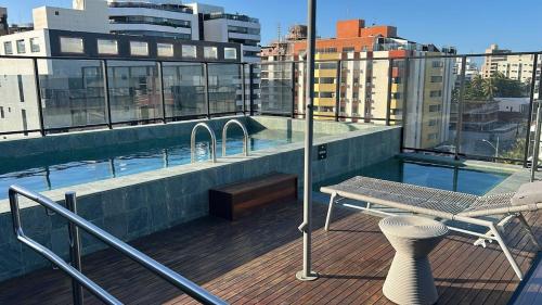 a balcony with a swimming pool on top of a building at Flat - Beira-Mar - Piscina - Intermares in Cabedelo