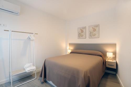 Postel nebo postele na pokoji v ubytování Alameda Apartments Calle Mayor