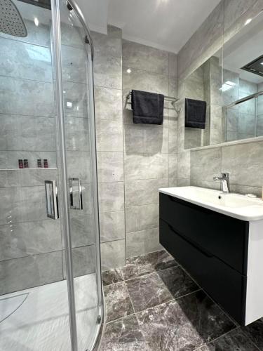 a bathroom with a sink and a shower at Asklepion Retreat in Kos