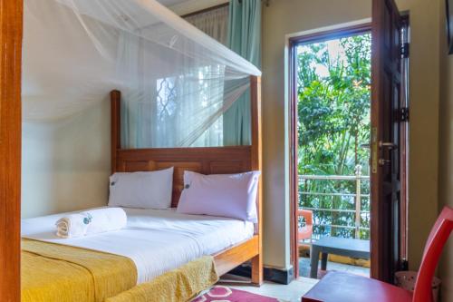 Postel nebo postele na pokoji v ubytování Palm Gardens Guesthouse