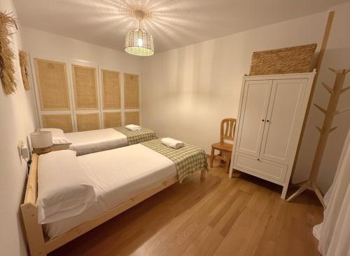 Postel nebo postele na pokoji v ubytování Arafita, cálido y familiar - Arafita Apartamentos