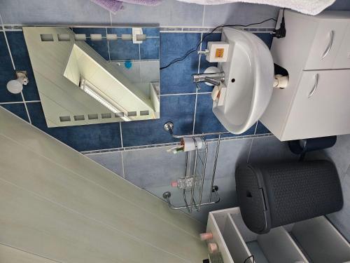 a bathroom with a urinal and a mirror on the wall at Ti harmoniel in Guingamp