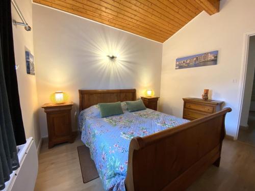 a bedroom with a bed and two night stands at Amaika karkula in Sare